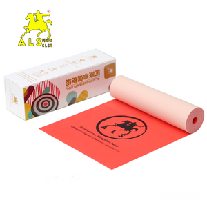 A top-down view of a DIY hand tools workspace, showing the 2-meter latex roll next to a slingshot frame, ready to be cut and adapted for crafting.