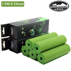 Unrolled green latex flat band showing thickness range 0.55–0.75 mm