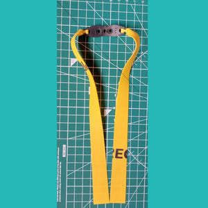 A user drawing the band back to its full mid pull length, demonstrating the steady pull needed for consistent performance.